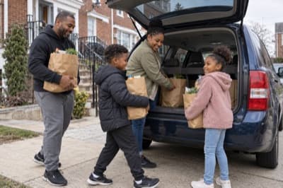 A family picking up their car